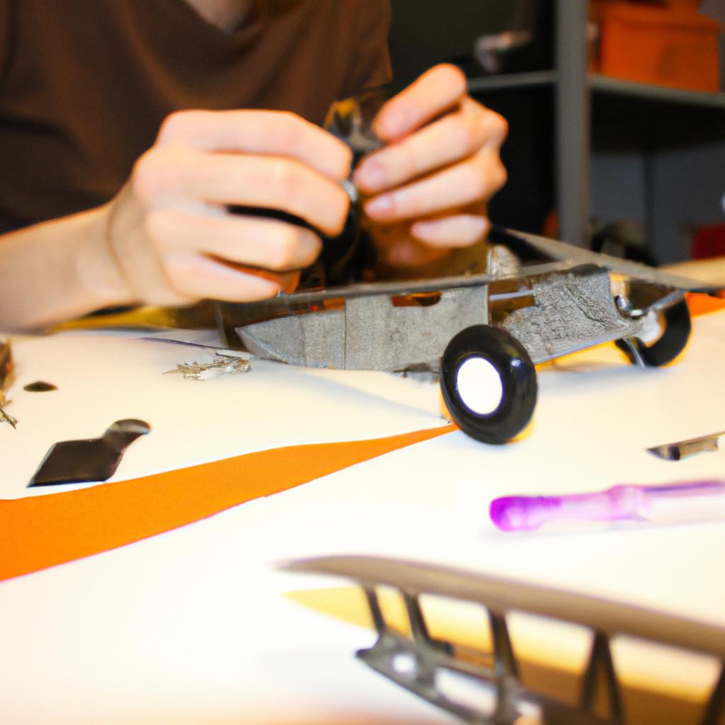 Person assembling RC plane parts