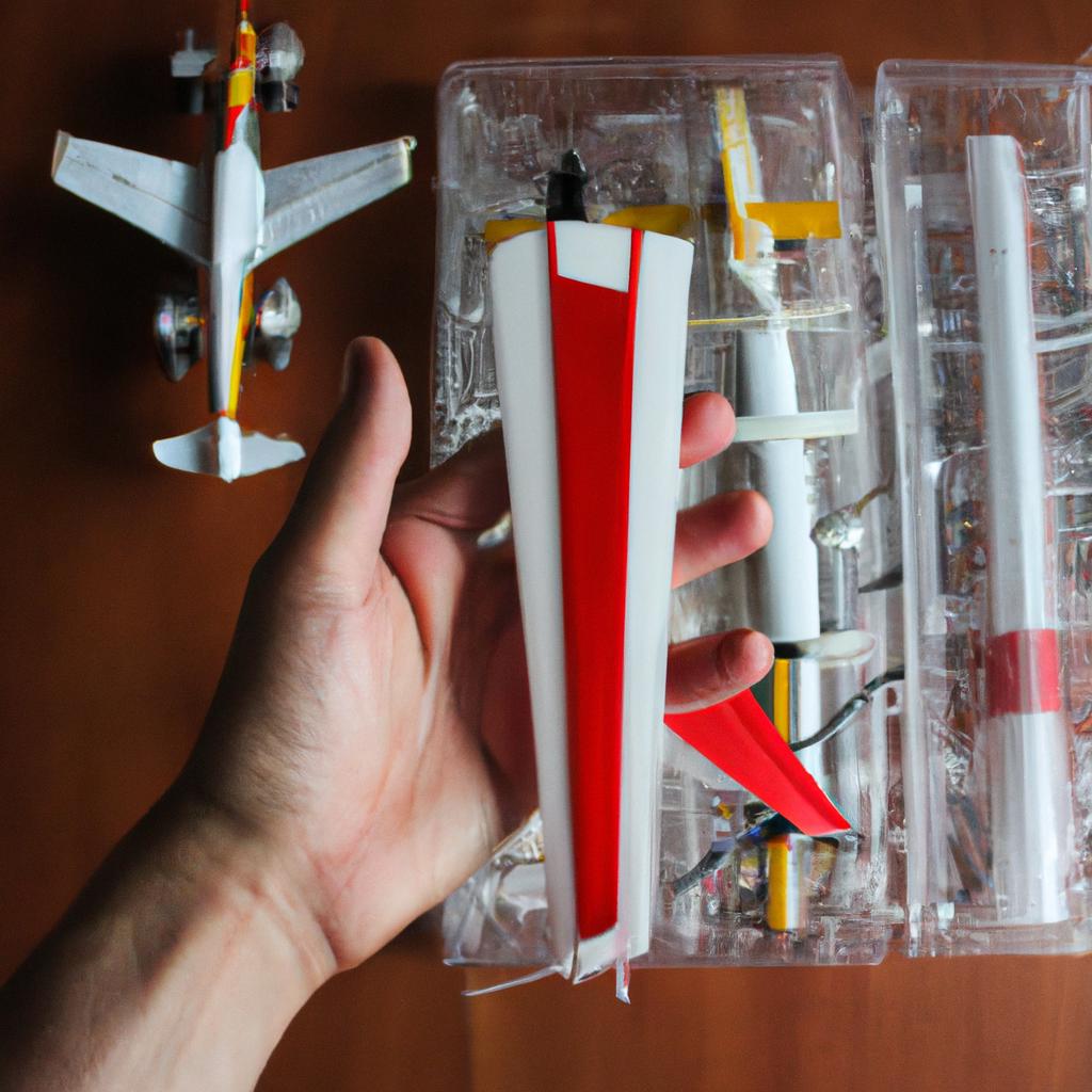 Person holding RC plane accessories