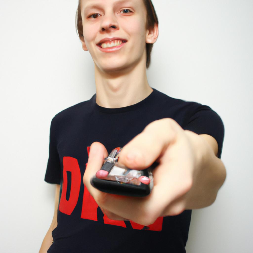 Person holding remote control, smiling