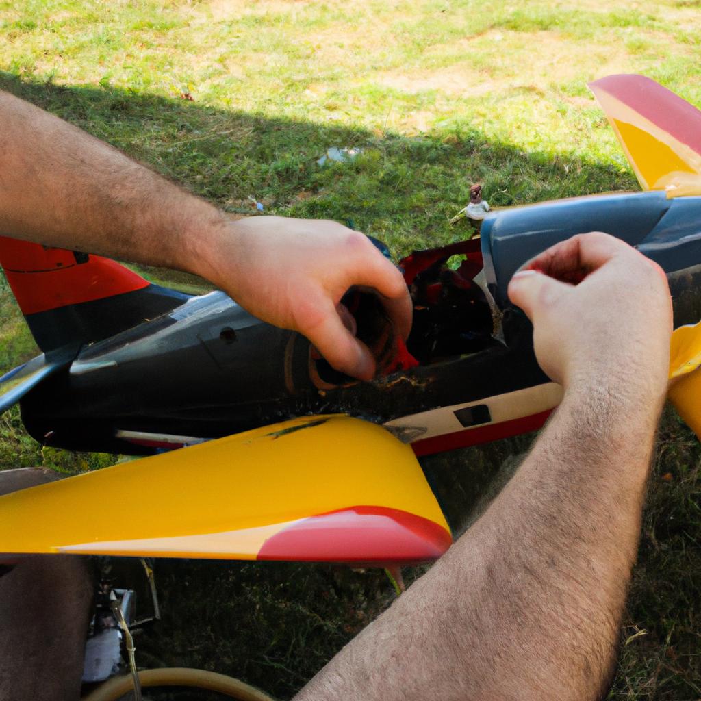 Person fixing RC plane problems