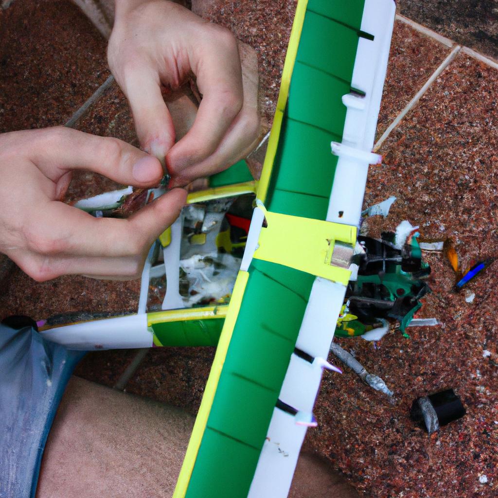 Person fixing RC plane issues
