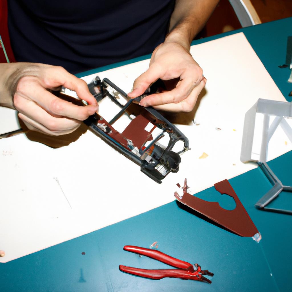 Person assembling RC airplane parts